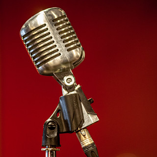 Retro Shure microphone on a red background